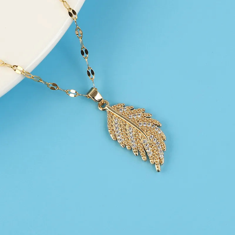 Elegant sapphire necklaces for women -Wholesale Casual Simple Style Feather Copper Inlay 18K Gold Plated Zircon Pendant Necklace